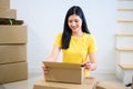 Thai entrepreneur couple are packing. Oline shopping and home delivery. Lock down and Self-quarantine Royalty Free Stock Photo