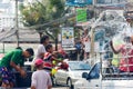 Thai family splashing water on Songkran festival