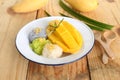 Thai famous delicious dessert - Closeup plate of sweet fresh ripe mango with three color of sticky rice , green from pandan and