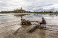 Thai farmer plowing the land with tiller, traditional plowing in rice field