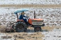 Thai farmer using walking tractors for cultivated soil for rice plantation in Thailand