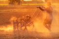 Thai farmer working in the land and making the hole on soil with machine to prepare the soil for growth tobacco season in Thailand