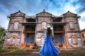 Thai female tourists gaze in ancient architecture French style village in Tharae Sakon Nakhon Landmark ancient of French in