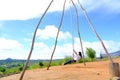 Thai female was playing wooden the swings at Khao Kho, Phetchabun, Thailand