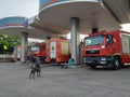 Thai Fire trucks refuel petrol at a gas station in Bangkok City.