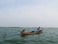 Thai fisherman and his boat