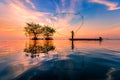 Thai fisherman with net in action Royalty Free Stock Photo