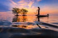 Thai fisherman with net in action Royalty Free Stock Photo