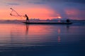 Thai fisherman with net in action Royalty Free Stock Photo