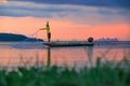 Thai fisherman with net in action Royalty Free Stock Photo