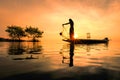 Thai fisherman with net in action Royalty Free Stock Photo