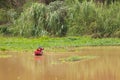 Thai Fisherman on ship in river