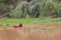 Thai Fisherman on ship in river