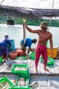Thai fishermen sorting day capture in Thailand