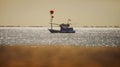 Thai fishery boat floating over plain sea