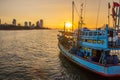 A fishing boat at a pier in the early evening during sunset time Royalty Free Stock Photo