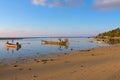 Thai fishing boats at low tide by the sea on koh samui island in Thailand Royalty Free Stock Photo