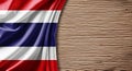 Thai Flag Draped on a Textured Wooden Surface with Copy Space Thailand silk Royalty Free Stock Photo
