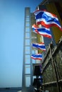 Thai flag waving in the wind by the sea