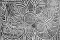 Thai flower carving on wood background