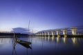 A Thai folk fishing boat made of wood, moored on the banks of the river in the morning Royalty Free Stock Photo