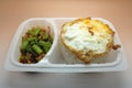 Thai food box, Fried egg over rice with stir fried chicken and vegetable