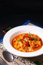 Thai Food concept Authentic Thai chicken Panang Curry, Panang Kai in ceramic bowl on black background with copy space