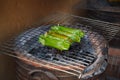 Thai Food, Dessert, Snack: Traditional roasted sweet sticky rice stuffed with variety of fruit fillings tropical produce; taro, Royalty Free Stock Photo