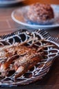 Thai food on dinner table, deep fried crispy makerel fish on beautiful plate Royalty Free Stock Photo