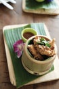 Thai food fried chicken in bamboo cup with dipping sauce Royalty Free Stock Photo