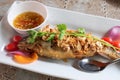 Thai food, fried fish with garlic and spicy source