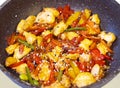 Thai food in a frying pan, teriyaki vegetables with sesame seeds