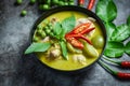 Thai food green curry on soup bowl with ingredient herb vegetable on dark plate background - green curry chicken cuisine asian Royalty Free Stock Photo