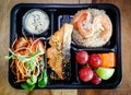 Thai food lunch boxs, Fried Rice and Seafood in take away plastic box Royalty Free Stock Photo