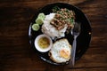 Thai food signature, Pad Kra Pao Khai Dow. Grill pork fry with her Royalty Free Stock Photo