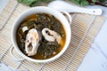 Thai food, Sour Soup (Gaeng Som Pla) Okra leaves in white cups