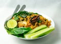 Thai food spicy flavored local salad with lemon & fresh vegetable isolated on white background. Thai food close - up photography.