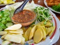 Thai Food Spicy Shrimp Paste Dip name is Nam Prink Kapi with Vegetables Cucumber Sunflower sprout Shoot Taste Salty and Spicy in T Royalty Free Stock Photo