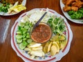 Thai Food Spicy Shrimp Paste Dip name is Nam Prink Kapi with Vegetables Cucumber Sunflower sprout Shoot Taste Salty and Spicy in T Royalty Free Stock Photo