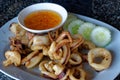 Thai food, Squid with garlic pepper Pla Muek Tod Kra Thiam Phrik Thai with sweet dipping Royalty Free Stock Photo