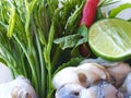 Thai food style, Fresh Oysters with vegetables acacia, lemon sliced and chili, as a background