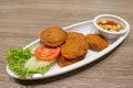 Thai Fried Fish-Paste Balls, Thai Style Fish Cake served with Thai cucumber salad. Royalty Free Stock Photo