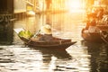 Thai fruit seller sailing wooden boat in thailand tradition floating market