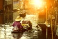 Thai fruit seller sailing wooden boat in thailand tradition floating market Royalty Free Stock Photo