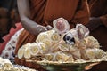 Thai funeral. Monks laying flowers in front of cremation flowers. Thai culture, Buddhism