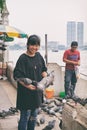 Thai girl and boy smiling and feeding pigeons Royalty Free Stock Photo