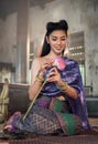 Thai girl making lotus flower in temple