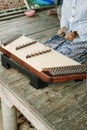 Thai girl playing Khim, the traditional Thai music Instrument. Leisure and hobby Royalty Free Stock Photo