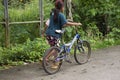 Thai girl and sisters people walking relax and biking bicycle on street at Baan Huay Nam Sai rural countryside village valley hill