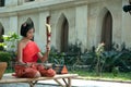 Thai girl in traditional dress in playing Thai fiddle.